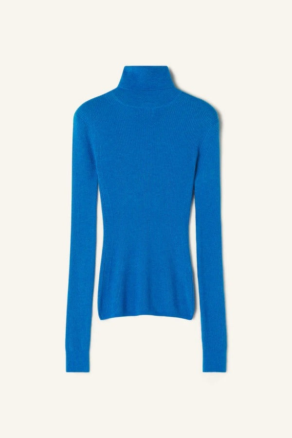 Front closeup view of electric blue turtleneck jumper on  white background, with no model shown.