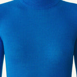 Front closeup view of electric blue turtleneck jumper on model, against a white background.