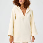 Front view of cream terry beach tunic on brown-haired model, against a white background.