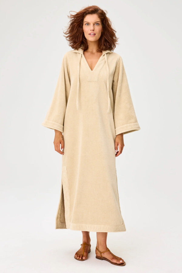 Front view of sand terry tunic caftan on model wearing brown sandals, against a white background.