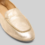 Front closeup of platinum mandolo mocassino on white background, with no model shown.