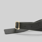 Side view of black marsell quadra belt on white background, with no model shown.
