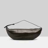 Back view of black marsell volta shoulder bag on white background, with no model shown.