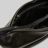 Open view of black marsell volta shoulder bag on white background, with no model shown.