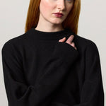 Front closeup view of nero amelia rn sweater on model, against a white background.