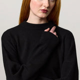 Front closeup view of nero amelia rn sweater on model, against a white background.