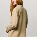 Back view of naturale beatrix db jacket on model wearing naturale skirt, against a white background.