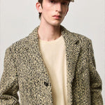Front view of pearl chance hat on model wearing herringbone jacket and milk top, against a white background.