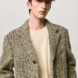 Front view of pearl chance hat on model wearing herringbone jacket and milk top, against a white background.