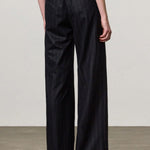 Back view of blu lamna trouser on model wearing brown top and boots, against a white background.