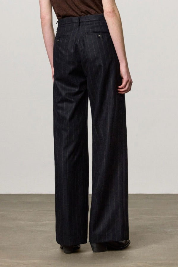 Back view of blu lamna trouser on model wearing brown top and boots, against a white background.