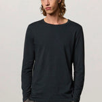 Front view of dark blue boa LS T-Shirt on model wearing tweed trousers, against a white background.