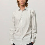 Front view of pine genova classic shirt on model wearing black trousers, against a white background.