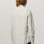 Back view of pine genova classic shirt on model wearing black trousers, against a white background.