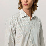 Front closeup view of pine genova classic shirt on model wearing black trousers against a white background.