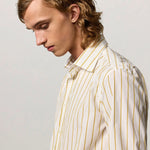Front closeup view of saffron genova shirt on model, against a white background.