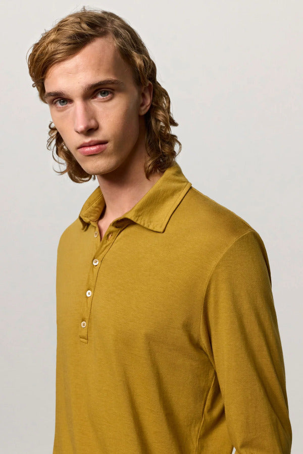 Front closeup view of saffron ischia ls polo shirt on model, against a white background.