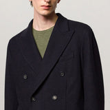 Front closeup view of blue brando db blazer on model wearing a green t-shirt, against a white background.