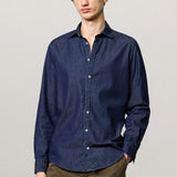 Front view of blu canary classic shirt on model wearing green pants, against a white background.