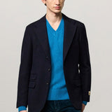 Front view of blue catch2 jacket on model wearing blue sweater and pants, against a white background.