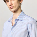 Front closeup view of azzurro genova classic shirt on model, against a white background.