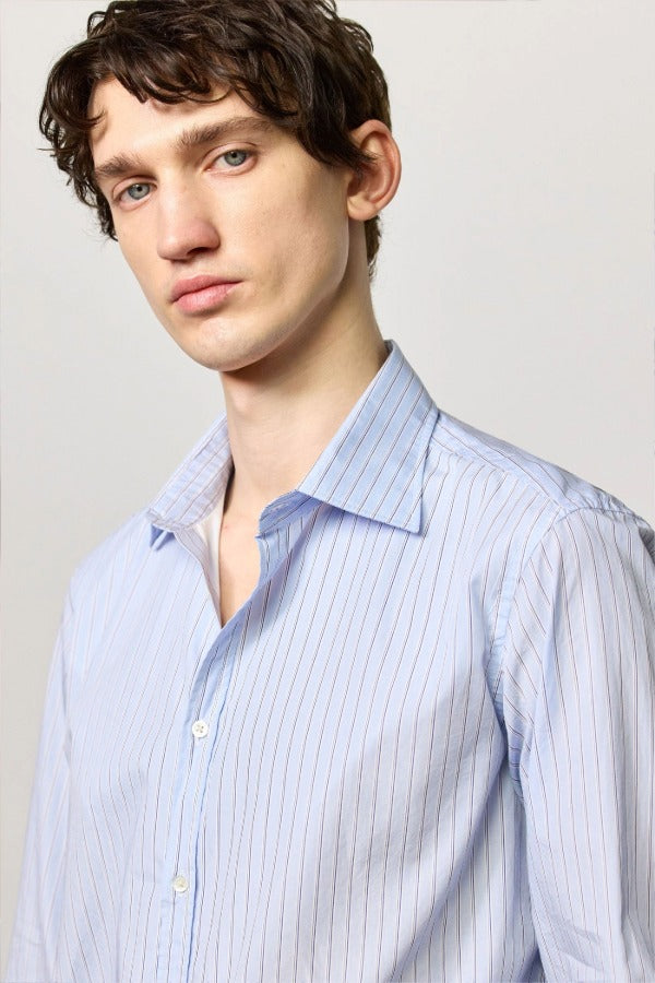 Front closeup view of azzurro genova classic shirt on model, against a white background.