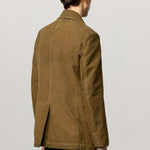 Back view of rusk lucio peacoat on model wearing blue pants, against a white background.