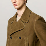 Side closeup view of rusk lucio peacoat on model, against a white background.