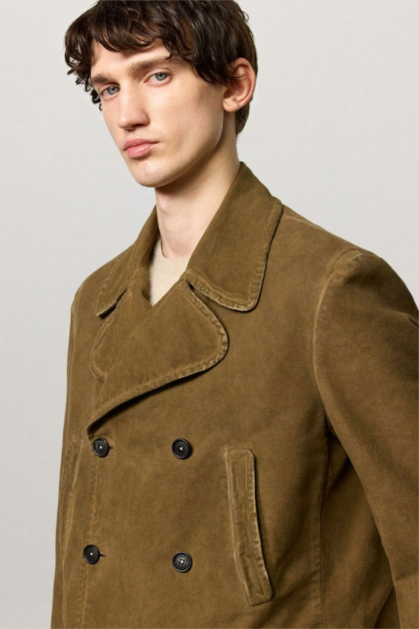 Side closeup view of rusk lucio peacoat on model, against a white background.