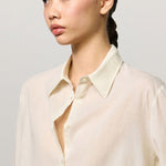 Front closeup view of milk selma classic shirt on model, against a white background.