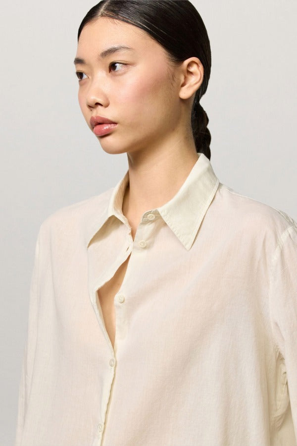 Front closeup view of milk selma classic shirt on model, against a white background.