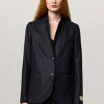 Front view of blu stromboli blazer on model wearing blu pants and brown top, against a white background.