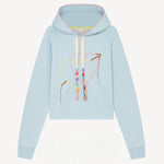 Front view of pale blue embroidered heart hoodie on white background, with no model shown.