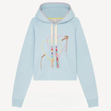 Front view of pale blue embroidered heart hoodie on white background, with no model shown.