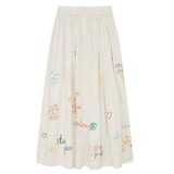 Back view of white embroidered scribble skirt on white background, with no model shown.