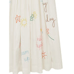 Front closeup view of embroidered scribble skirt against white background, with no model shown.