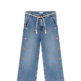 Front view of mid blue embroidered straight leg jean on white background, with no model shown.