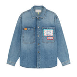 Front view of mid blue embroidered word patch denim overshirt on white background, with no model shown.