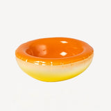 Front view of orange hand sprayed ombre bowl on white background, with no model shown.