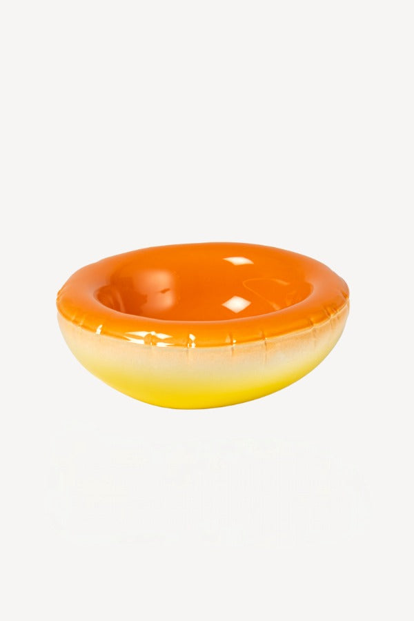 Front view of orange hand sprayed ombre bowl on white background, with no model shown.