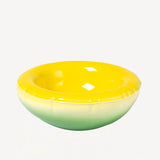 Front view of yellow hand sprayed ombre bowl on white background, with no model shown.