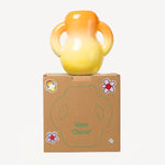 Alternate front view of orange hand sprayed ombre vase on box against a white background, with no model shown.