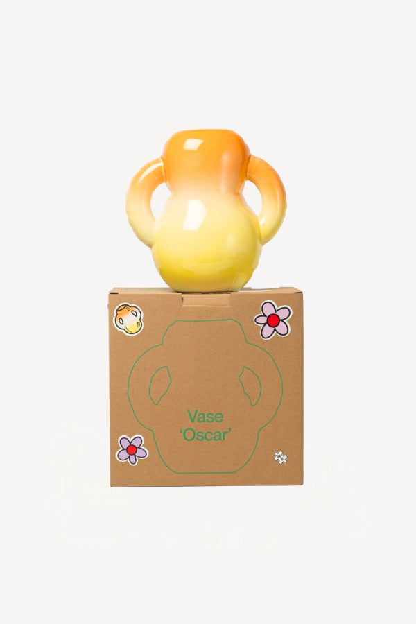 Alternate front view of orange hand sprayed ombre vase on box against a white background, with no model shown.