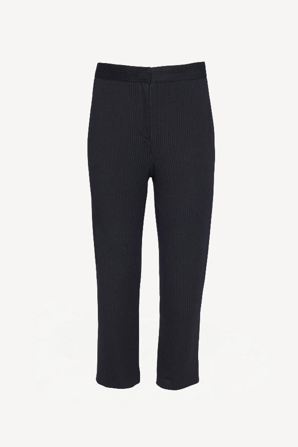 Front view of navy pinstriped universal pant on white background, with no model shown.