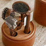 Overhead view of Pansage grooming kit on stone background, with no model shown