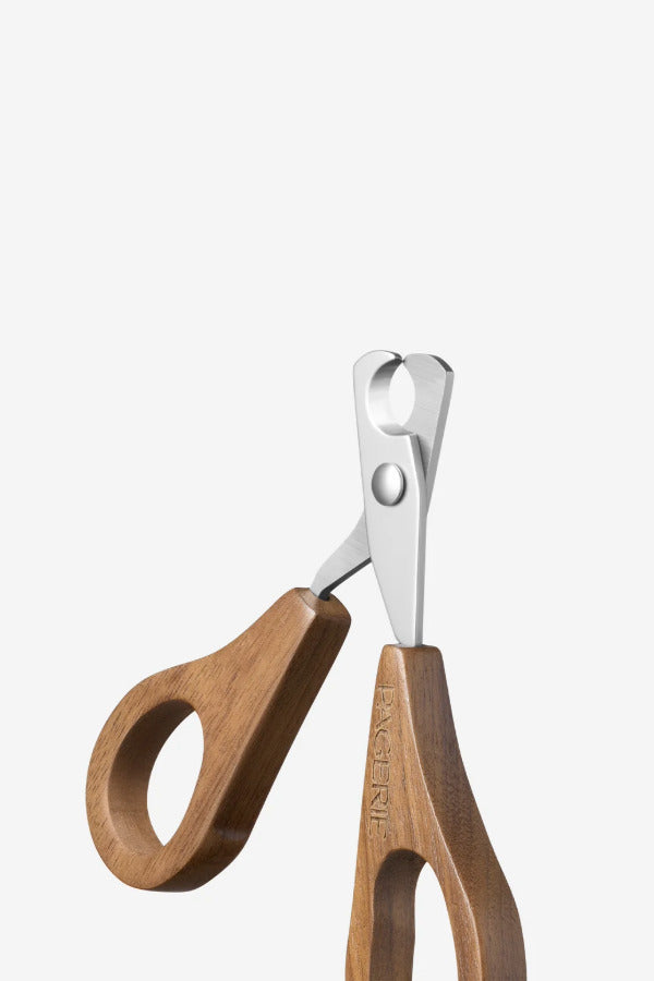 Front view of nail clippers on white background, with no model shown.