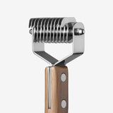 Back view of shedding blade on white background, with no model shown.