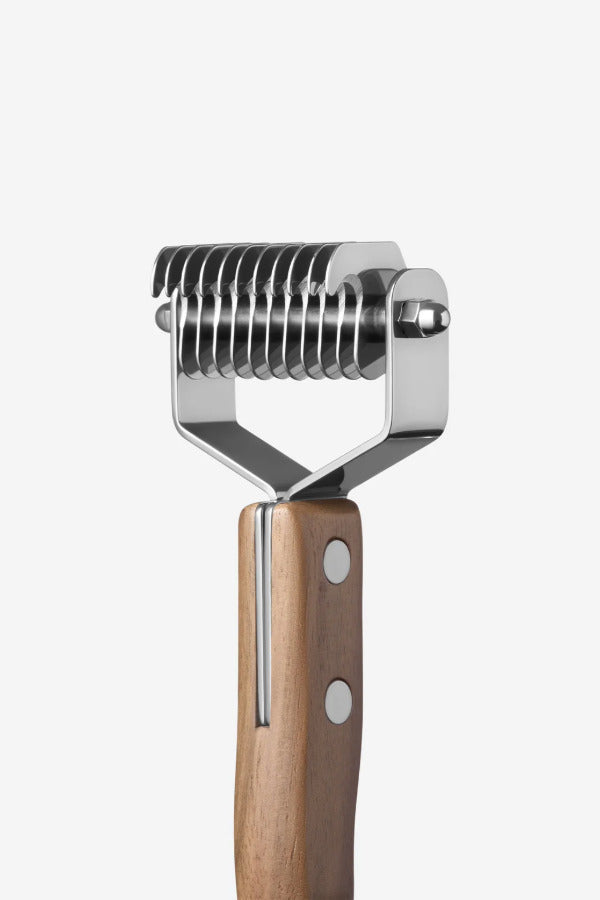 Back view of shedding blade on white background, with no model shown.