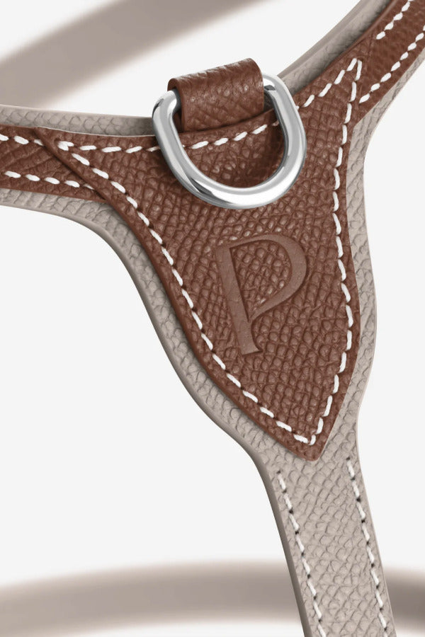 Front closeup view of walnut petite harness on white background, with no model shown.