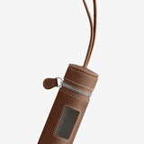 Front view of walnut the pouchette dog bag holder on white background, with no model shown.